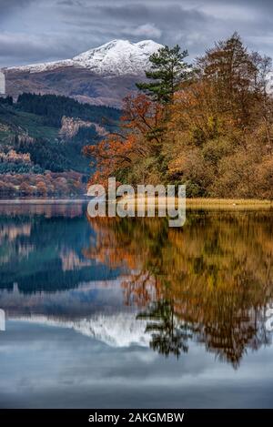 Looking across Loch Ard in the Scottish Highlands to the snowy summit of Ben Lomond Stock Photo