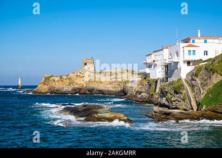 Greece, Cyclades archipelago, Andros island, Hora (or Andros), the ruins of the Venitian castle and Tourlitis lighthouse in the background Stock Photo