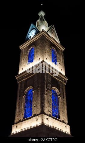 Clock tower with lights at night near Old Giaffa (Jaffa) in Tel Aviv, ISRAEL Stock Photo
