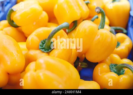 Fresh raw organic yellow pepper vegetables for sale at farmers market. Vegan food and healthy nutrition concept. Top view stock photo yellow pepper Stock Photo
