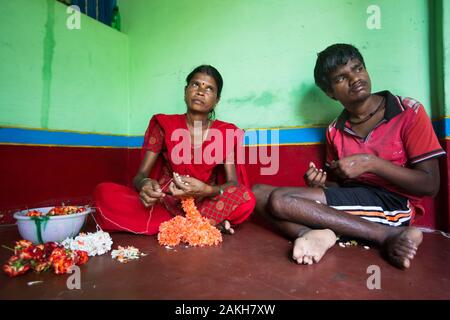 CAPTION: Ningarajamma is a flower vendor. Thanks to the Chamkol programme's Revolving Fund Scheme, she has been able to invest in this business and in Stock Photo