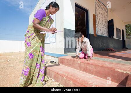 CAPTION: Steps prove a significant challenge for Ashwin, who has diplegia and can only get around unassisted if on his hands and knees. The Chamkol pr Stock Photo