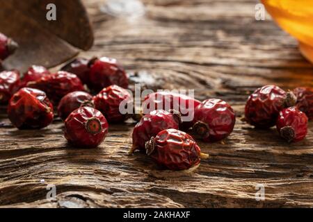 Detail of dried rose hips on a table Stock Photo