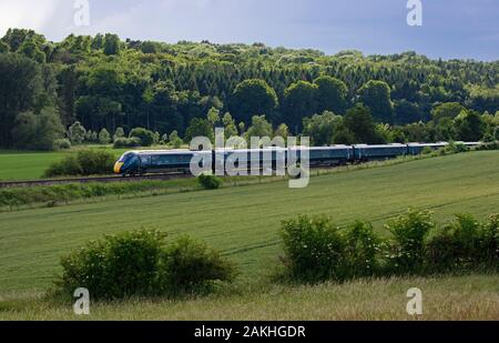 New dual fuel diesel electric hitachi class 800 intercity GWR train travelling through cotswold countryside,England Stock Photo