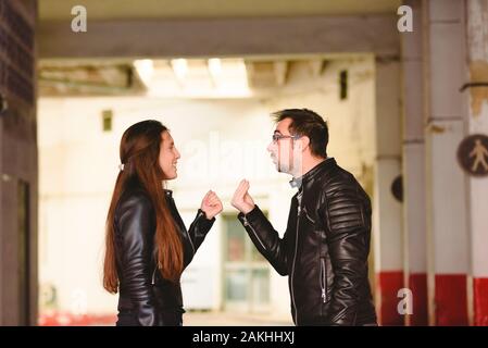 Angry millennial couple arguing and blaming each other of problem, frustrated about their relationship. Stock Photo
