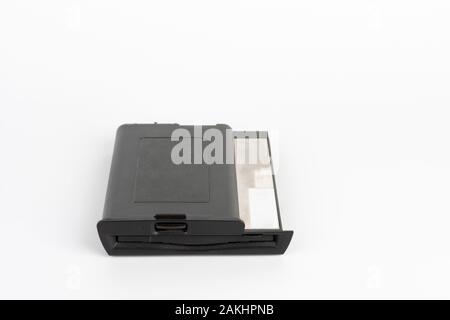 Floppy disk drive from 16 year old laptop on white background Stock Photo