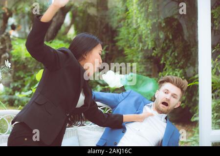 business people argue in meeting and asian woman fighting man about mistake in work at office, businesswoman angry and blaming businessman with partne Stock Photo