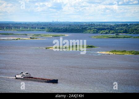 Barge on river sailing to port for cargo. Transport for transportation of crushed stone and sand Stock Photo