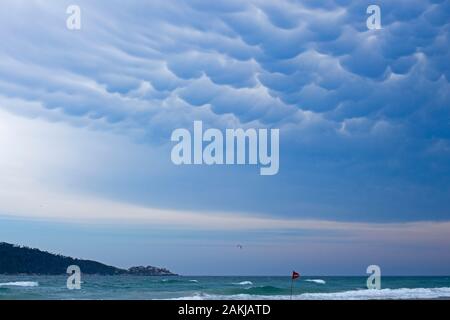 Strange cloud formation over the sea on a beach in Santa Catarina. A spectacular cloudscape. Stock Photo