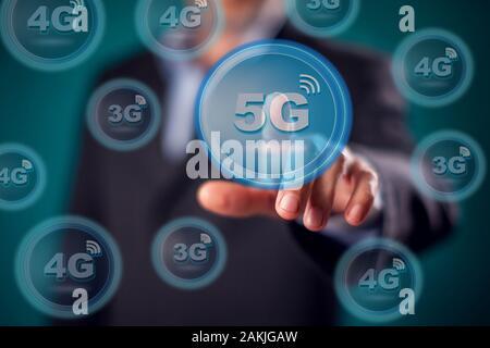 Businessman in suit press virtual 5g button. People and internet technology concept Stock Photo
