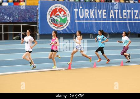 ISTANBUL, TURKEY - DECEMBER 29, 2019: Athletes running during Turkish Athletic Federation Indoor Athletics Record Attempt Races Stock Photo