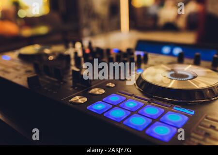 DJ remote, turntables, and hands . Night life at the club, party Stock Photo