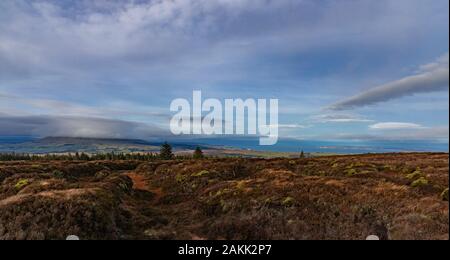 Knocklayd mountain cloud covered, and Rathlin Island, viewed from Crockaneel hill, Ballypatrick forest, County Antrim, Northern Ireland Stock Photo