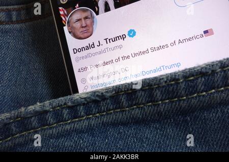 Twitter page for Donald Trump displayed on smartphone hidden in jeans pocket Stock Photo