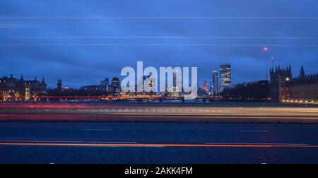 River Thames, London, UK. 9th January 2020. UK Weather: Light trails along Westminster Bridge with the lights of the rapidly changing Vauxhall skyline in the background on a dull and grey January morning. Credit: Celia McMahon/Alamy Live News.