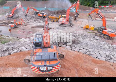 Machines at work on the demolition of a bridge across the A50 in Uttoxeter. Stock Photo