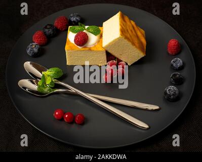 Appetizing cottage cheese casserole on white plate close up Stock Photo