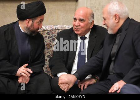 Tehran, Iran. 9th Jan, 2020. This handout picture provided by the office of Iran's Supreme Leader Ayatollah Ali Khamenei on January 9, 2020, shows Iraqi leader of the Hashed al-Shaabi paramilitary force Faleh al-Fayyad (C) alongside Iranian Foreign Minister Mohammad Javad Zarif (R) and Iraqi Shiite Muslim leader and head of Hikma party Ammar al-Hakim (L) attending a mourning ceremony held by the supreme leader in Tehran for slain top general Qasem Soleimani. Credit: Khamenei.Ir/ZUMA Wire/Alamy Live News Stock Photo