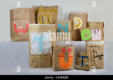 big paper surprise bags with german lettering WUNDERTÜTE on it, which means surprise bag Stock Photo