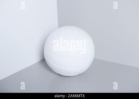 White volleyball ball isolated on white and grey background. Stock Photo