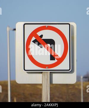 No left turn sign posted as a warning to drivers. Stock Photo
