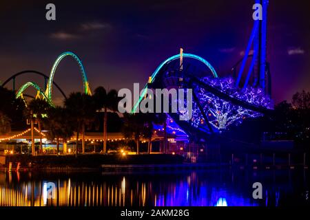 Orlando, Florida. December 30, 2019. Colorful tree iluminated and rollercoasters at Seaworld Stock Photo