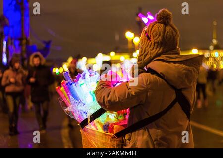 street vendor with a basket of multi-colored lamps Stock Photo
