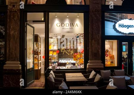 A retail Godiva Chocolate shop storefront in the indoor Galeries Royales Saint-Hubert shopping mall in Brussels Belgium. Stock Photo