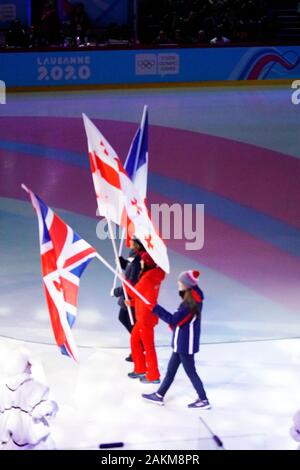 Lausanne, Switzerland . 09th Jan, 2020. Laussane, Switzerland, three members of the different teams including the UK are entering the stadium during the opening ceremony waving with the national flags on January 09th 2020 Credit: AlfredSS/Alamy Live News Stock Photo