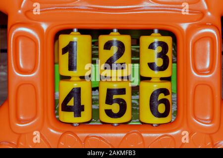 Fragment of a multi-colored children's panel game complex with numbers. Stock Photo