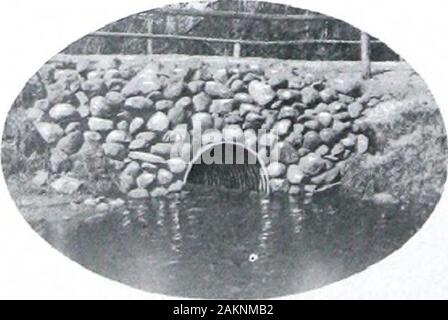 Apollo best bloom and Appollo-keystone copper steel galvanized sheets . Four-foot Apollo Galvanized Culvert which replaced a ten-foot wooden bridge in roadway near Alpena, Mich. Stock Photo