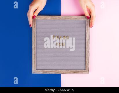 Thank you written on board on colorful background Stock Photo