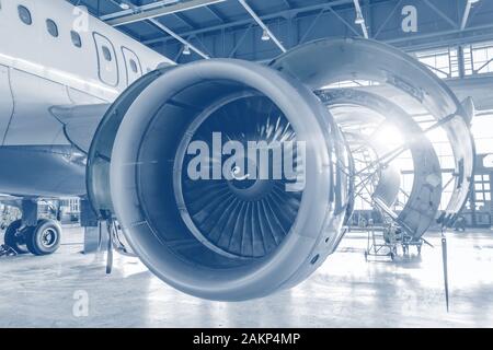 Engine of the airplane under heavy maintenance, open hood Stock Photo