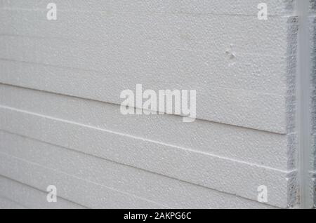 Styrofoam sheets in a stack. A set of polystyrene sheets for external insulation and waterproofing walls. Close-up. Selective focus. Stock Photo