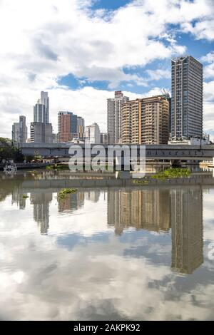 Dec 31, 2019 Manila downtown cityscape seen from the Pasig river, Manila, Philippines Stock Photo