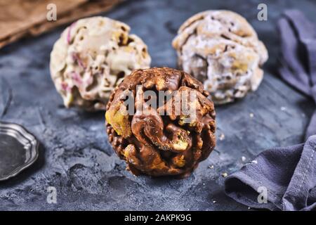 Different flavors of ball shaped traditional German sweet food called 'Schneeballen', meaning 'Snowball', made from shortcrust pastry Stock Photo