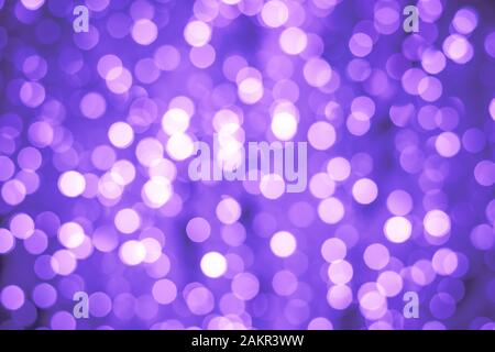 Abstract bokeh background. Blurred backdrop with illuminated effect. Purple night lights, defocused shiny circles Stock Photo