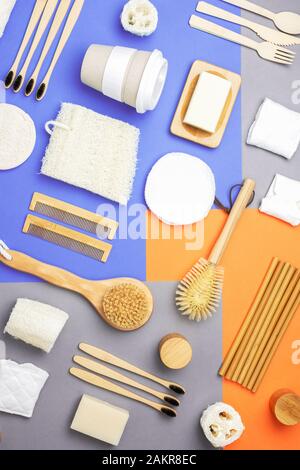 Zero waste eco friendly personal care products wooden brushes, bamboo toothbrushes, bath accessories, natural soaps, reusable coffee cup on colorful p Stock Photo