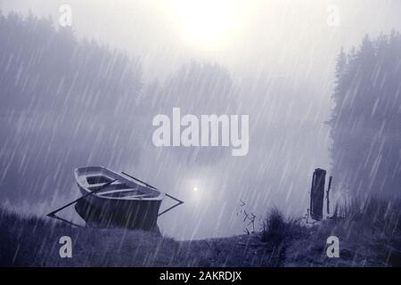 A lonely boat on the shore of a lake. Heavy rain and heavy fog. Water is like a mirror. The sun shines through the clouds. Black and white photo. Stock Photo