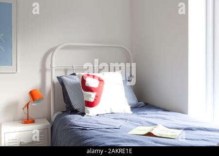 white metal single bed Stock Photo