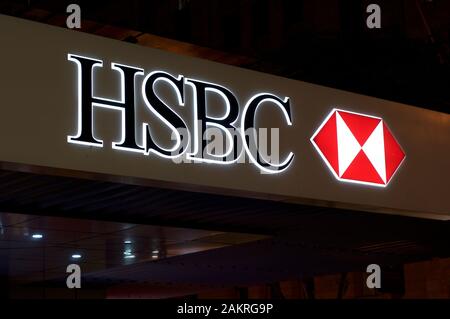 Brisbane, Queensland, Australia - 20th December 2019 : Illuminated HSBC Bank sign hangin in front of the bank building in Brisbane. HSBC Holdings is a Stock Photo