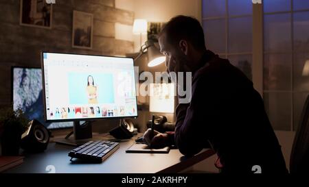 Unhappy photographer while retouching photos. Creative young artist. Stock Photo