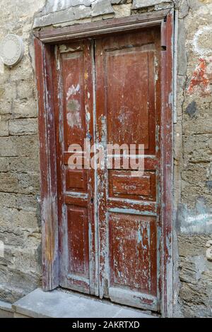 old wooden door in a stone wall in the old city of Baku Stock Photo