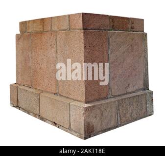 The base for a old aged statue made of roughly processed big granite aged blocks. Isolated on white Stock Photo