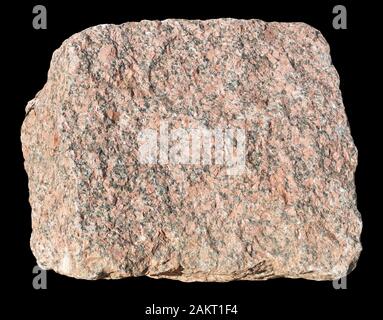 The big ancient square shape  red granite stone. Isolated on black  with patch Stock Photo