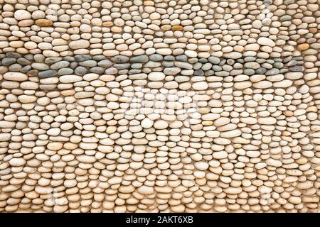 Stone wall made of cobblestones Stock Photo
