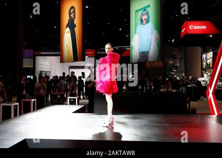 Las Vegas, United States. 10th Jan, 2020. A model walks the stage at the Canon booth during the 2020 International CES, at the Las Vegas Convention Center in Las Vegas, Nevada on Thursday, January 9, 2020. Photo by James Atoa/UPI Credit: UPI/Alamy Live News Stock Photo