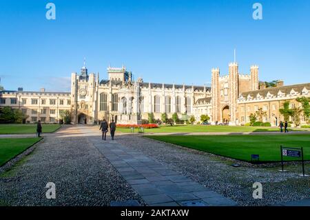 Cambridge, Cambridgeshire / United Kingdom - June 17, 2016 : Students walking front of the famous Trinity college on a bright summer day, Cambridge, C Stock Photo