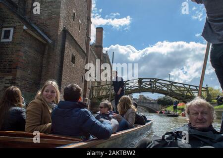 Cambridge, Cambridgeshire / United Kingdom - June 17, 2016 : People enjoying punting on river cam on a bright sunny day in front of the mathematical b Stock Photo