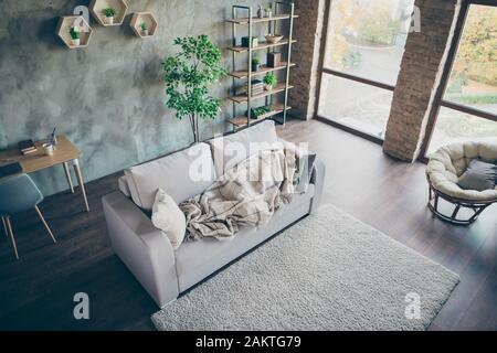 Top above high angle view of her she nice gray-haired middle aged grandma lying on divan resting relaxing recreation industrial brick loft modern Stock Photo